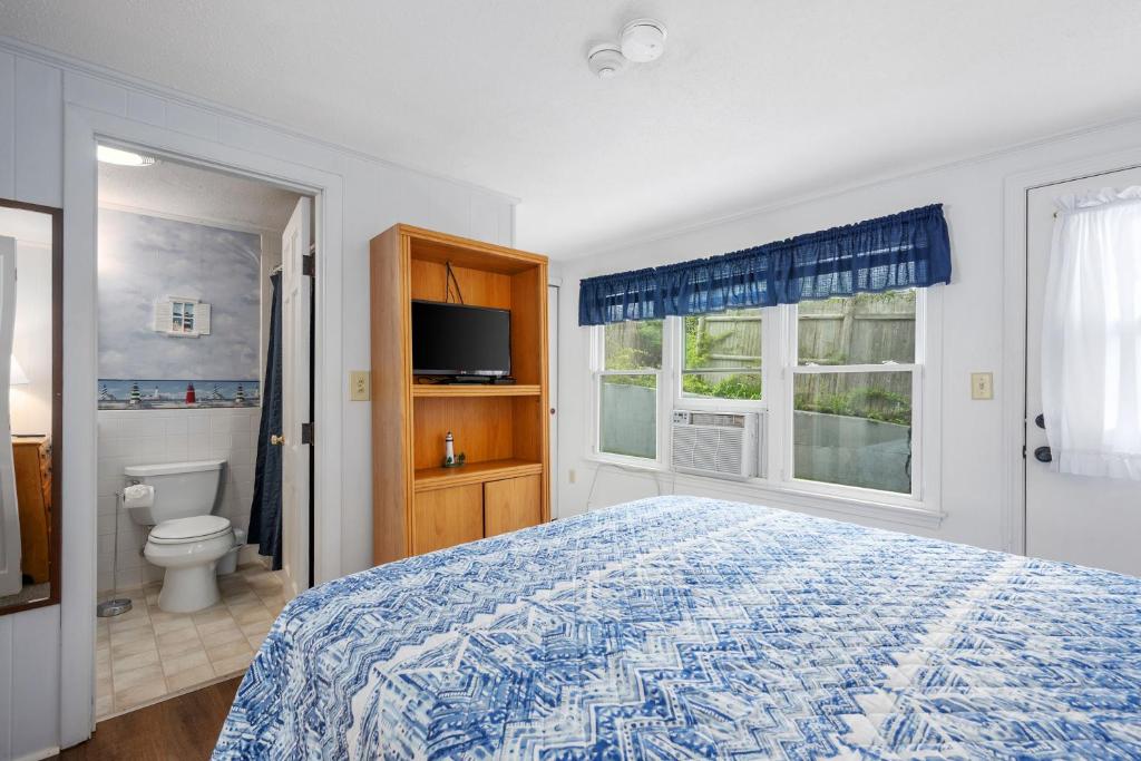 Voodi või voodid majutusasutuse Oceanside Condos toas