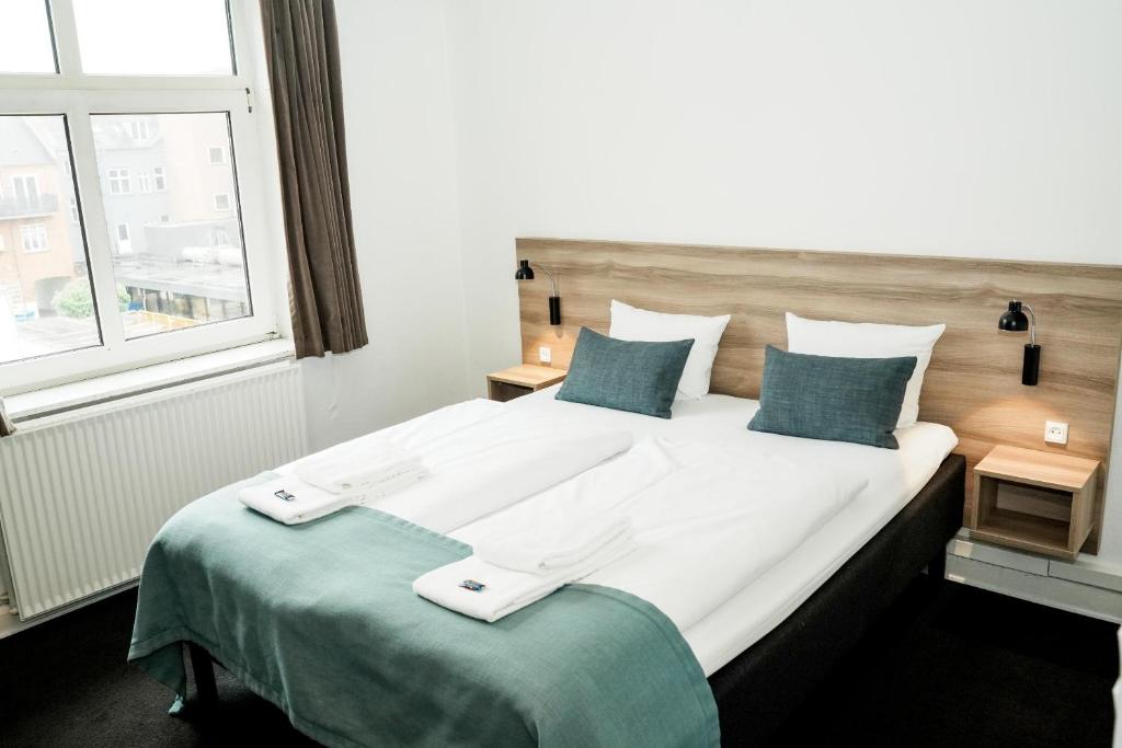 Postel nebo postele na pokoji v ubytování Hotel Ansgar