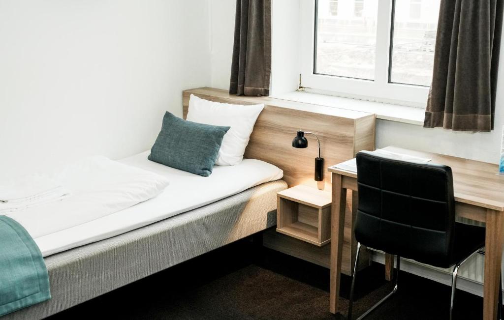 Postel nebo postele na pokoji v ubytování Hotel Ansgar