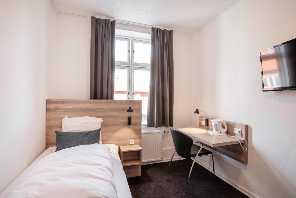 Postel nebo postele na pokoji v ubytování Hotel Ansgar