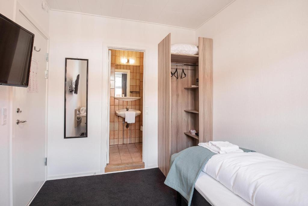 Postel nebo postele na pokoji v ubytování Hotel Ansgar