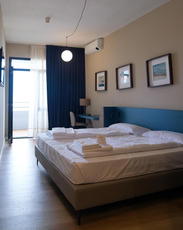 Postel nebo postele na pokoji v ubytování Aria Life Hotel