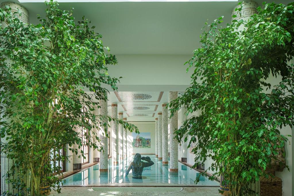 a building with trees in the middle of a hallway at Palazzo Manzi Terme & Spa in Casamicciola Terme