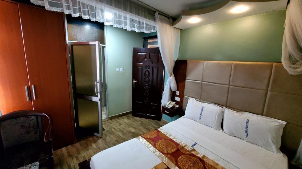 Postel nebo postele na pokoji v ubytování Chello Suites
