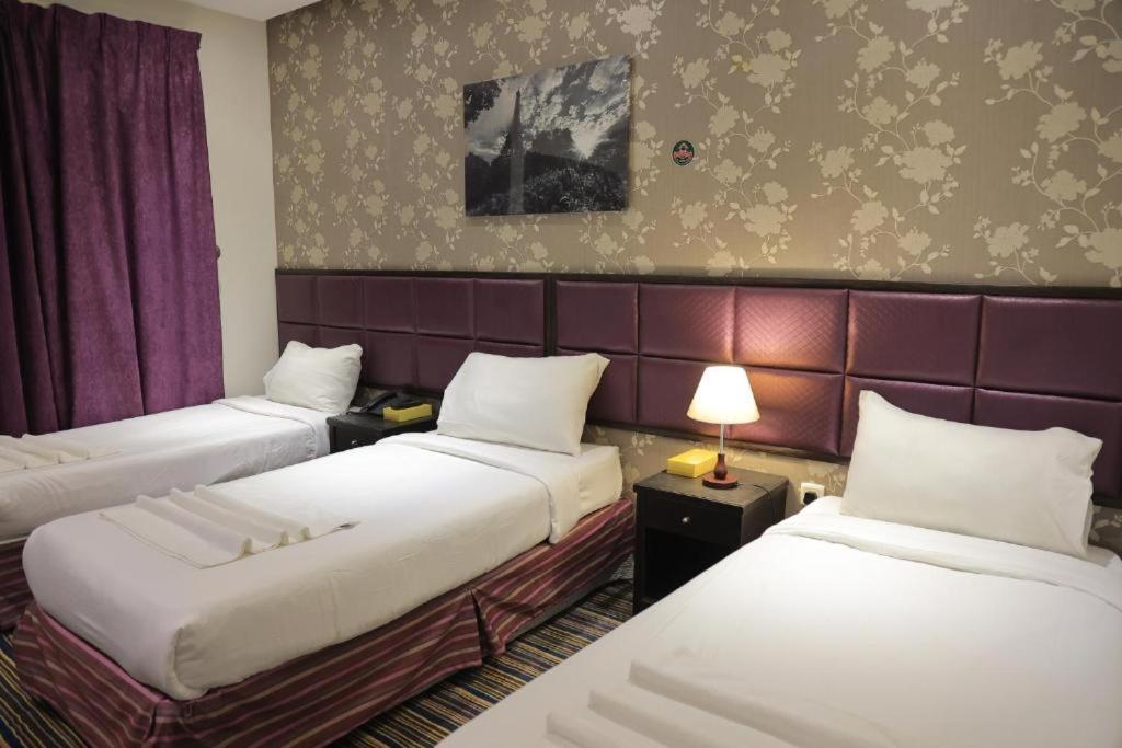 Postel nebo postele na pokoji v ubytování Snood Al Baraka Hotel