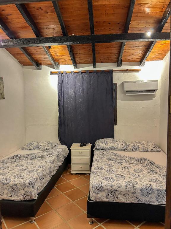 Voodi või voodid majutusasutuse Hosteria El Castellano toas