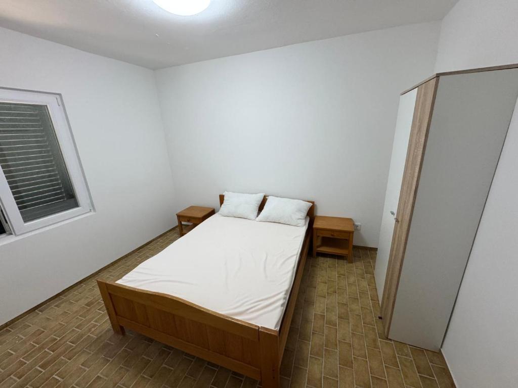Postel nebo postele na pokoji v ubytování Apartments Prosika