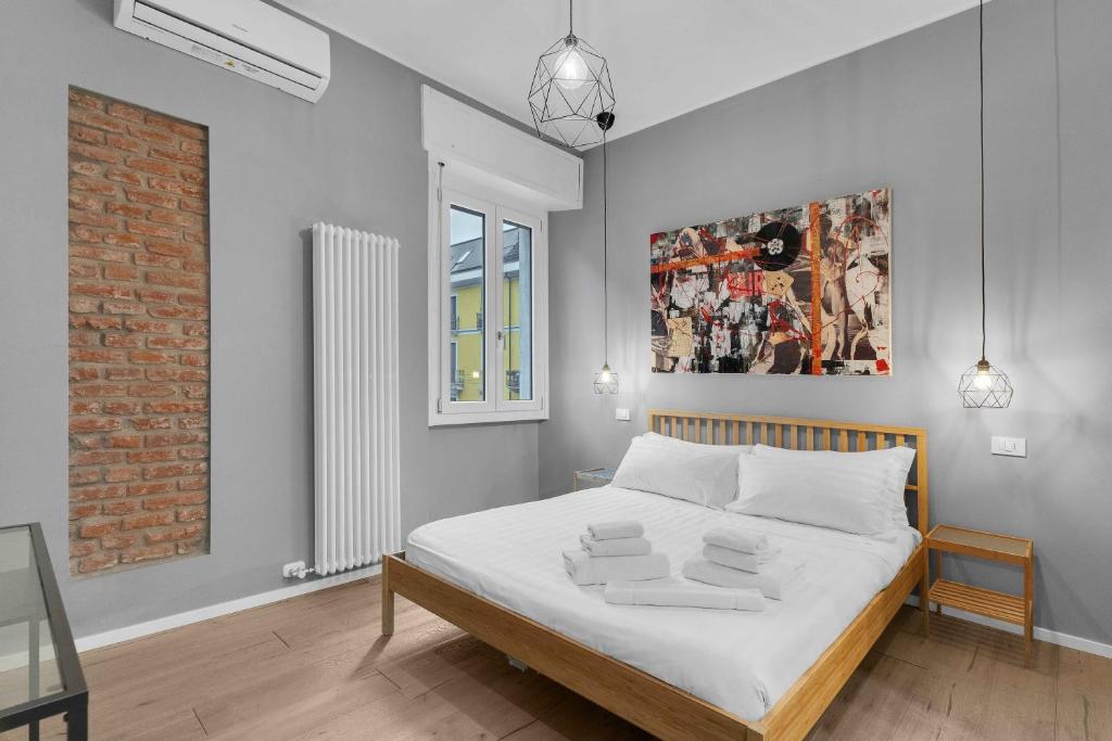 Postel nebo postele na pokoji v ubytování Via Rosmini house