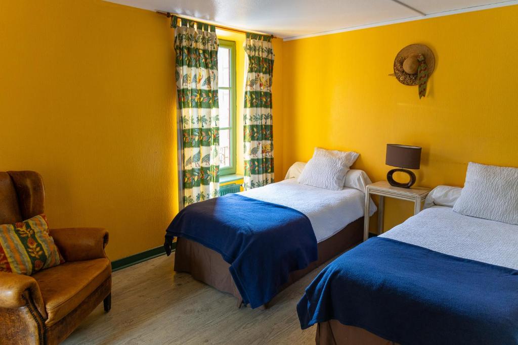 Postel nebo postele na pokoji v ubytování Auberge de Forgès