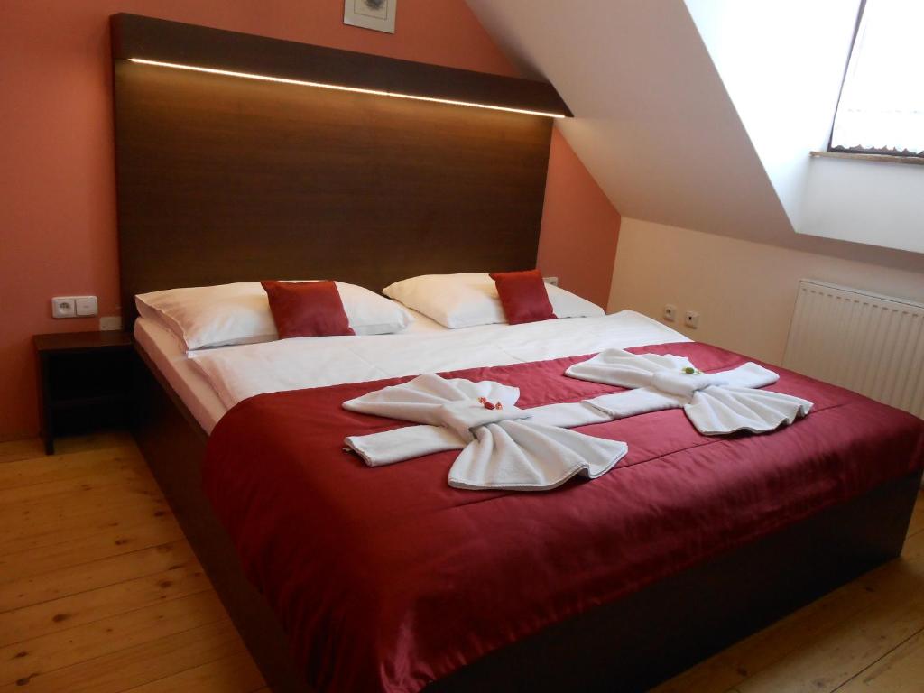 Postel nebo postele na pokoji v ubytování Hotel U Martina