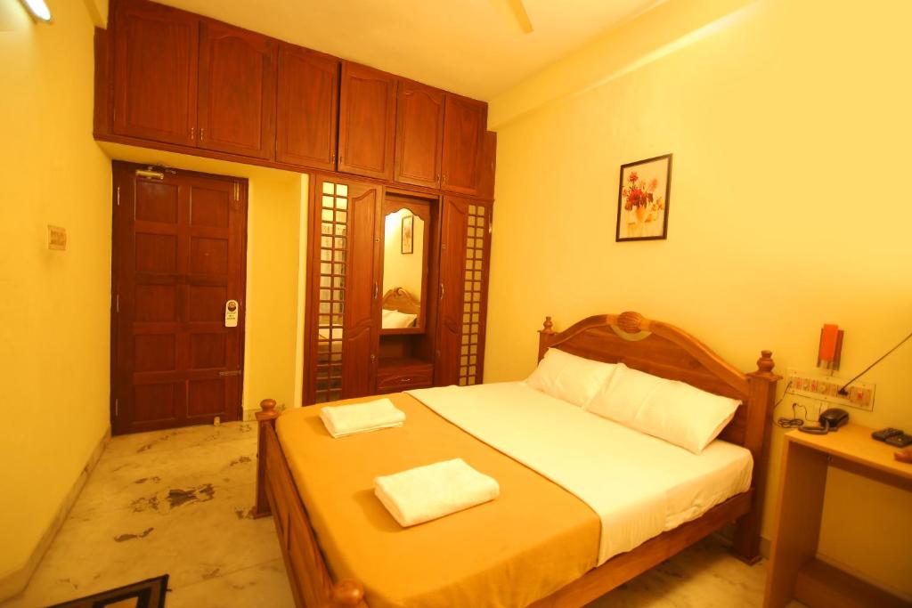 Postel nebo postele na pokoji v ubytování Metropolitan Serviced Villa