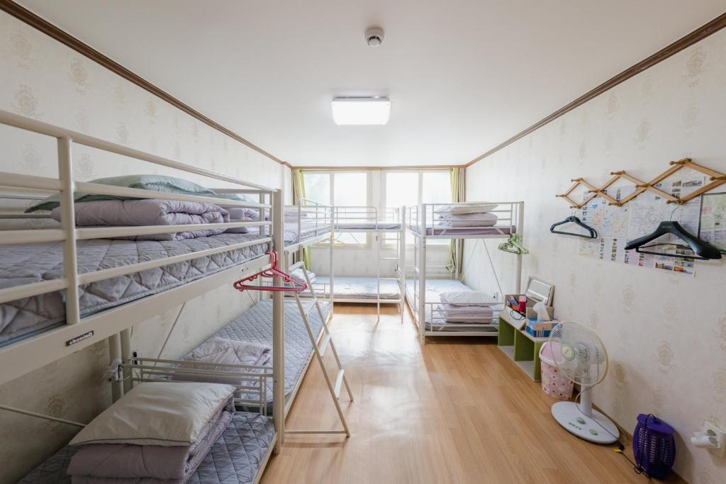 Postel nebo postele na pokoji v ubytování Panda Guesthouse