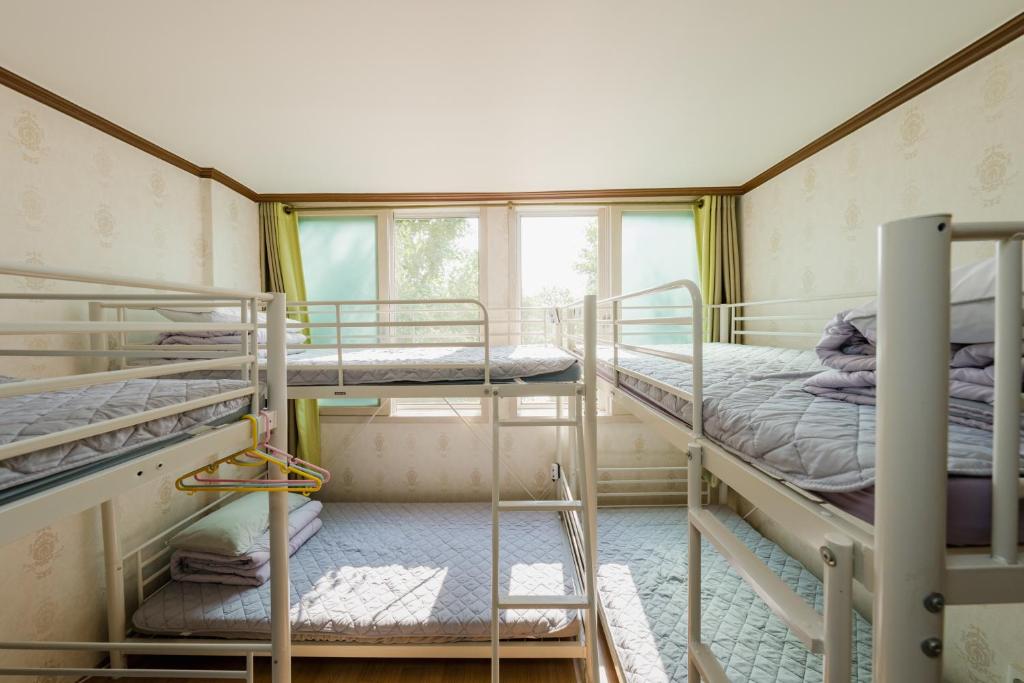 Postel nebo postele na pokoji v ubytování Panda Guesthouse