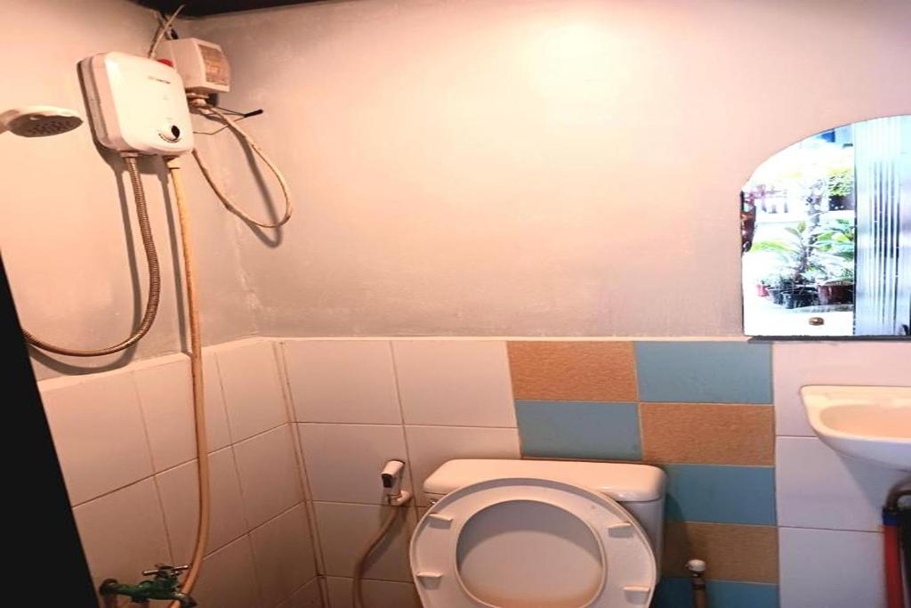 Koupelna v ubytování Hometel Barrio House Mactan