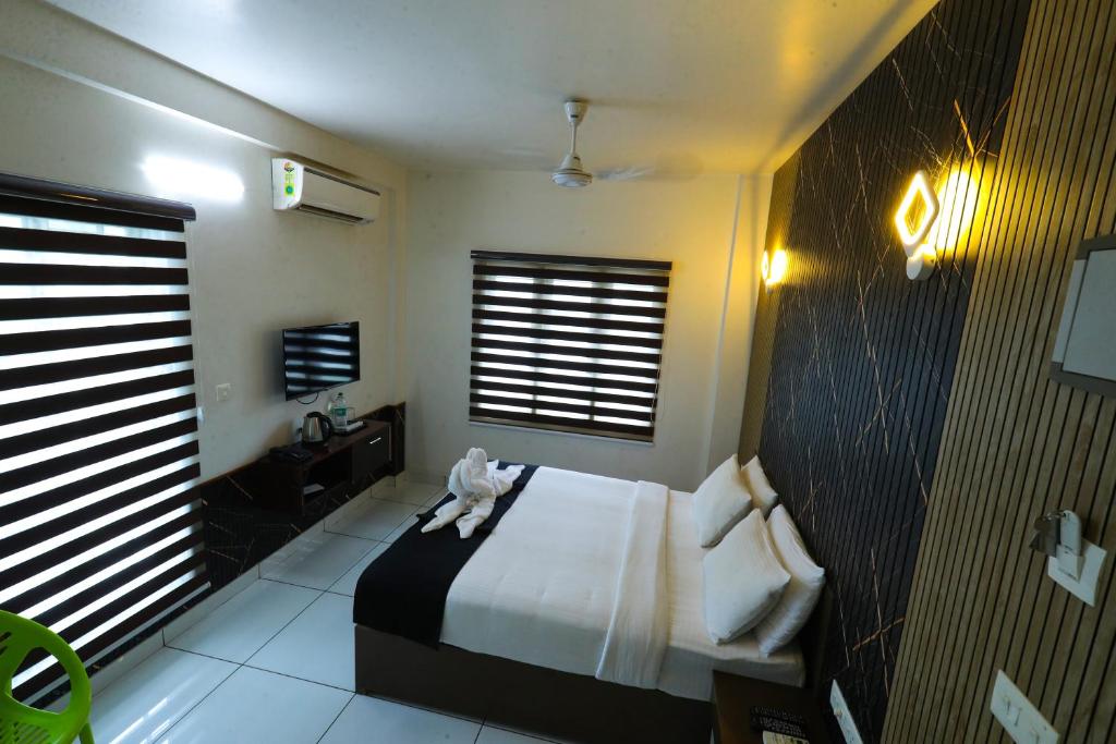 Postel nebo postele na pokoji v ubytování D-Green Hotels