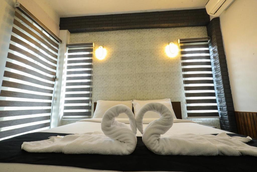 Postel nebo postele na pokoji v ubytování D-Green Hotels