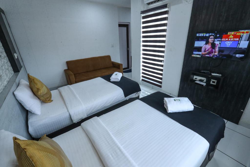 Postel nebo postele na pokoji v ubytování D-Green Hotels
