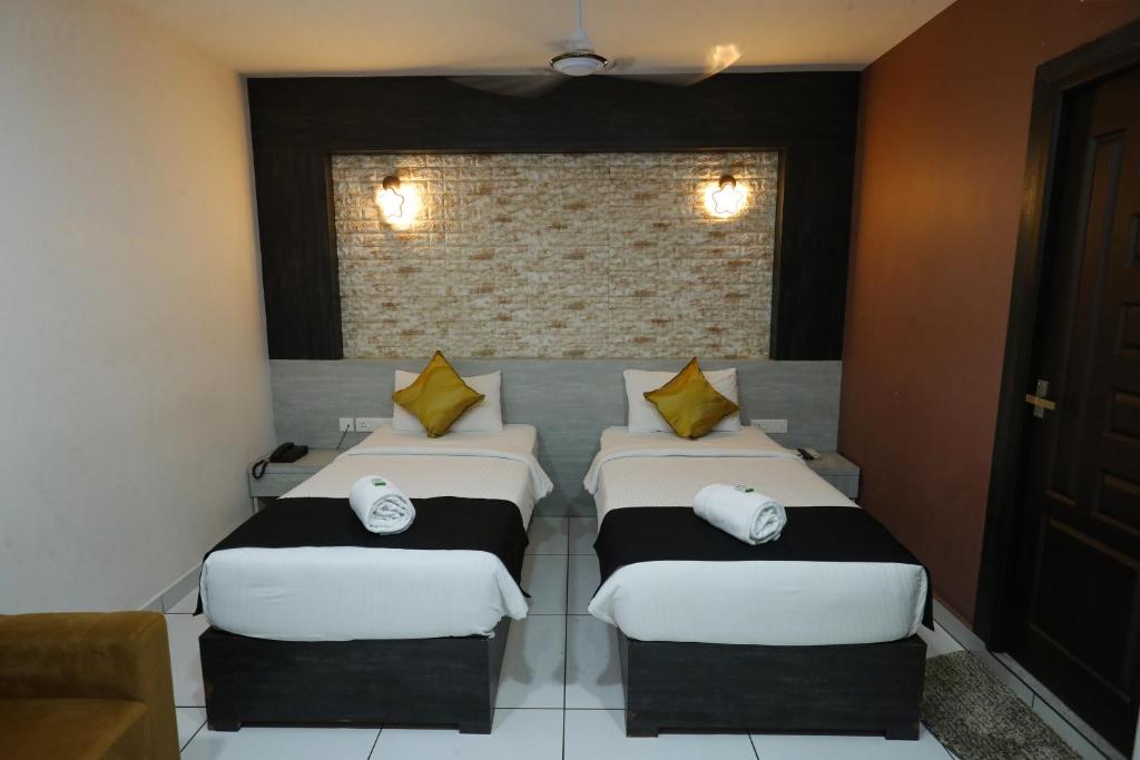 Postel nebo postele na pokoji v ubytování D-Green Hotels