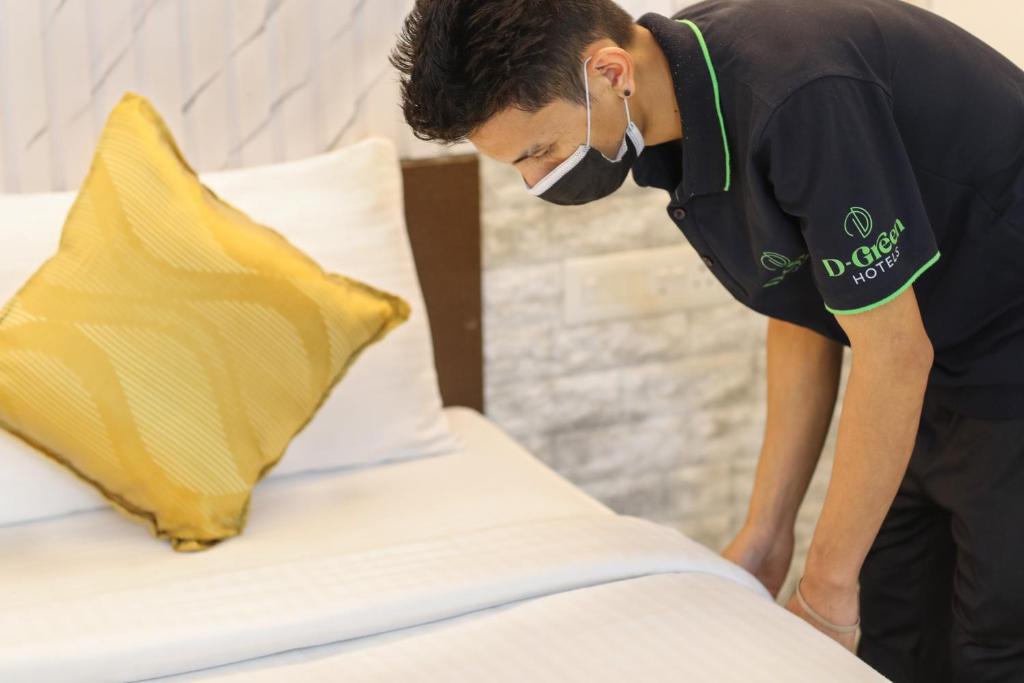 Postel nebo postele na pokoji v ubytování D-Green Hotels