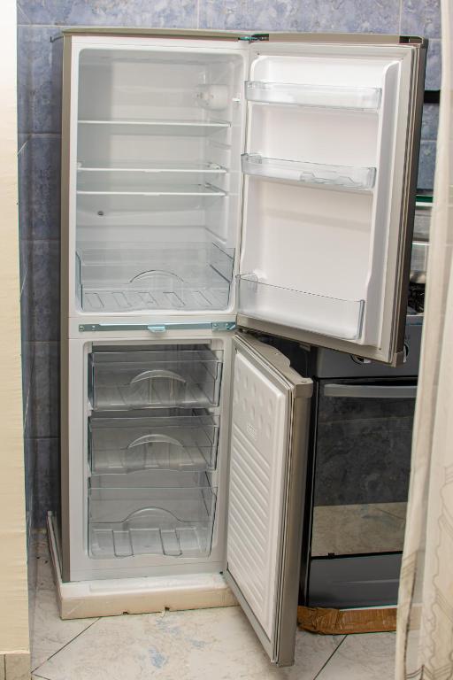 Kuchyň nebo kuchyňský kout v ubytování Appartement meublé Nsam