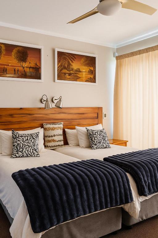 Ένα ή περισσότερα κρεβάτια σε δωμάτιο στο Lagoon Step Self catering Unit