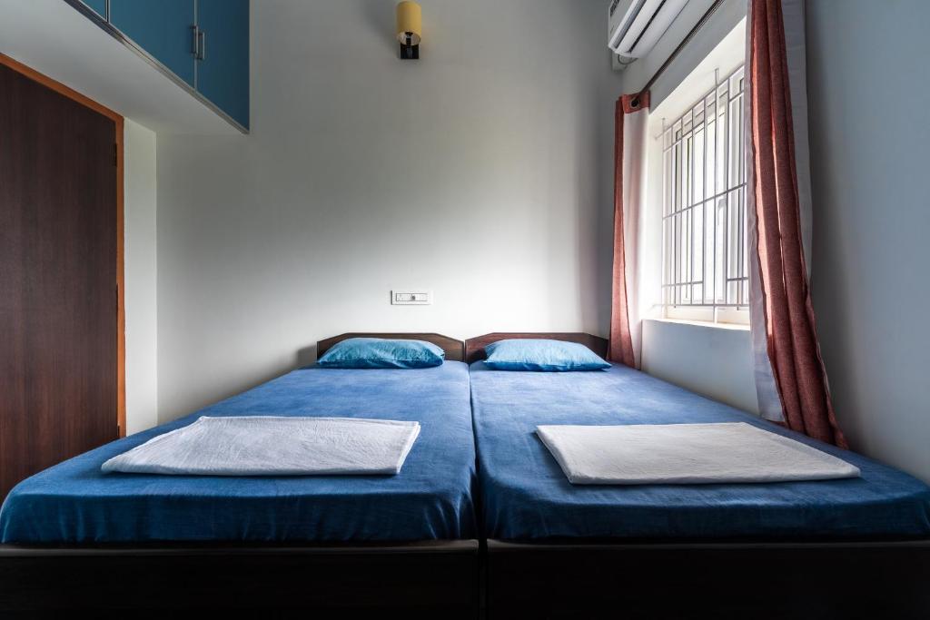 Ένα ή περισσότερα κρεβάτια σε δωμάτιο στο Meenakshi residency