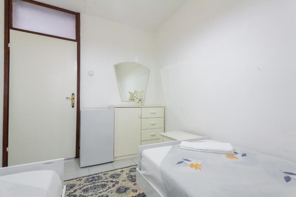 Postel nebo postele na pokoji v ubytování Rooms Molabeciri