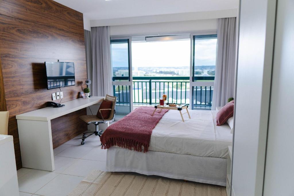 En eller flere senge i et værelse på V1307 Flat com vista para a Esplanada