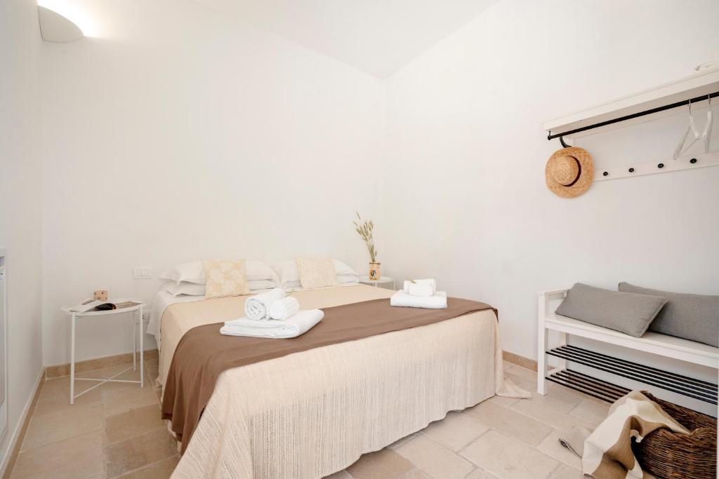 Postel nebo postele na pokoji v ubytování Trulli Lithos Suite