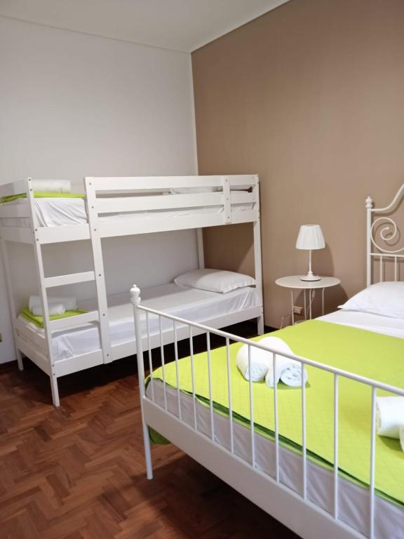 Postel nebo postele na pokoji v ubytování A I R Sorrento House