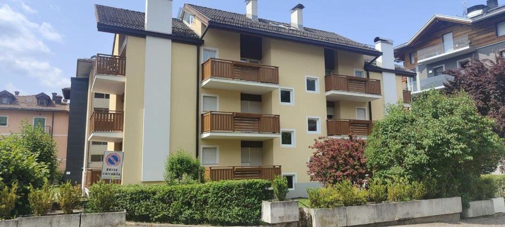 a large apartment building with balconies on it at Appartamenti Donatella in Cavalese