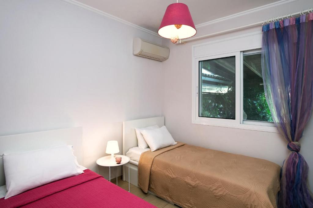 Posteľ alebo postele v izbe v ubytovaní Beach Villa Blue by PosarelliVillas