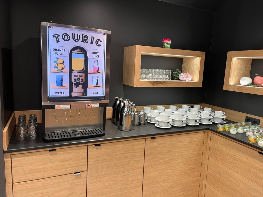 Kuchyň nebo kuchyňský kout v ubytování Hotel Touric