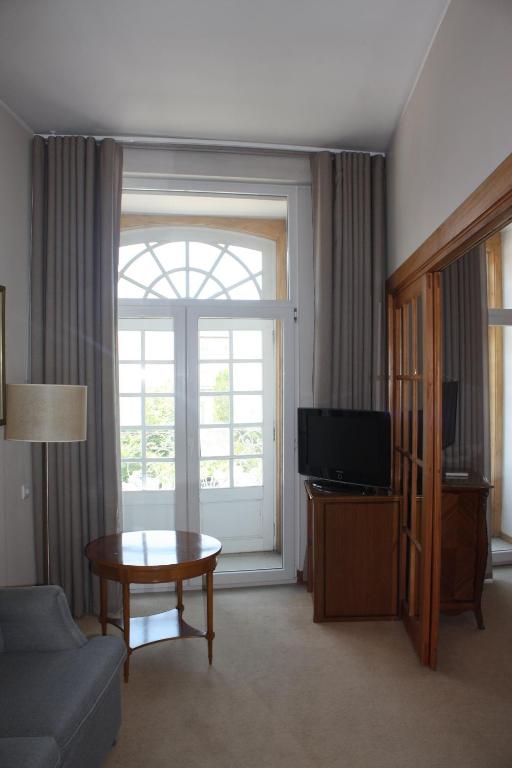 TV a/nebo společenská místnost v ubytování Hotel Toural