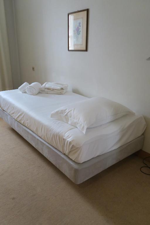Postel nebo postele na pokoji v ubytování Hotel Toural