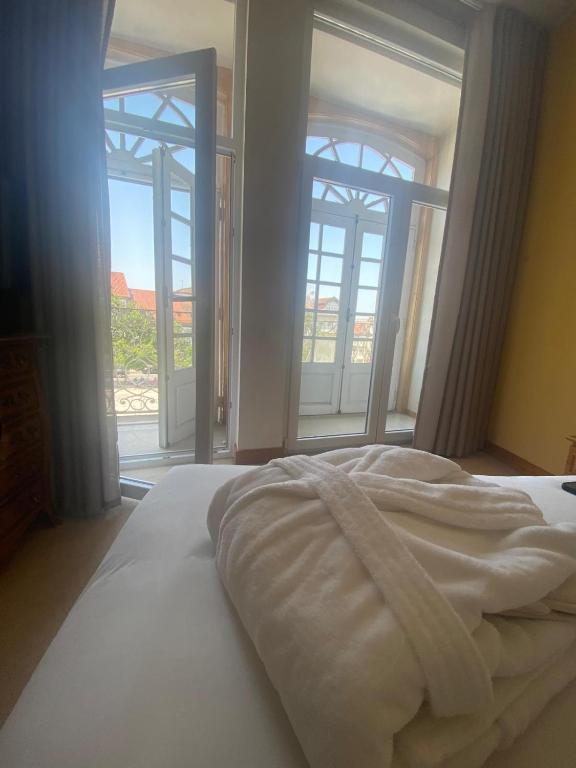 Postel nebo postele na pokoji v ubytování Hotel Toural