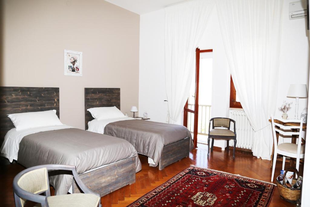 Postel nebo postele na pokoji v ubytování Virò House
