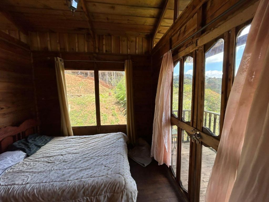 Postel nebo postele na pokoji v ubytování Cabañas la esperancita