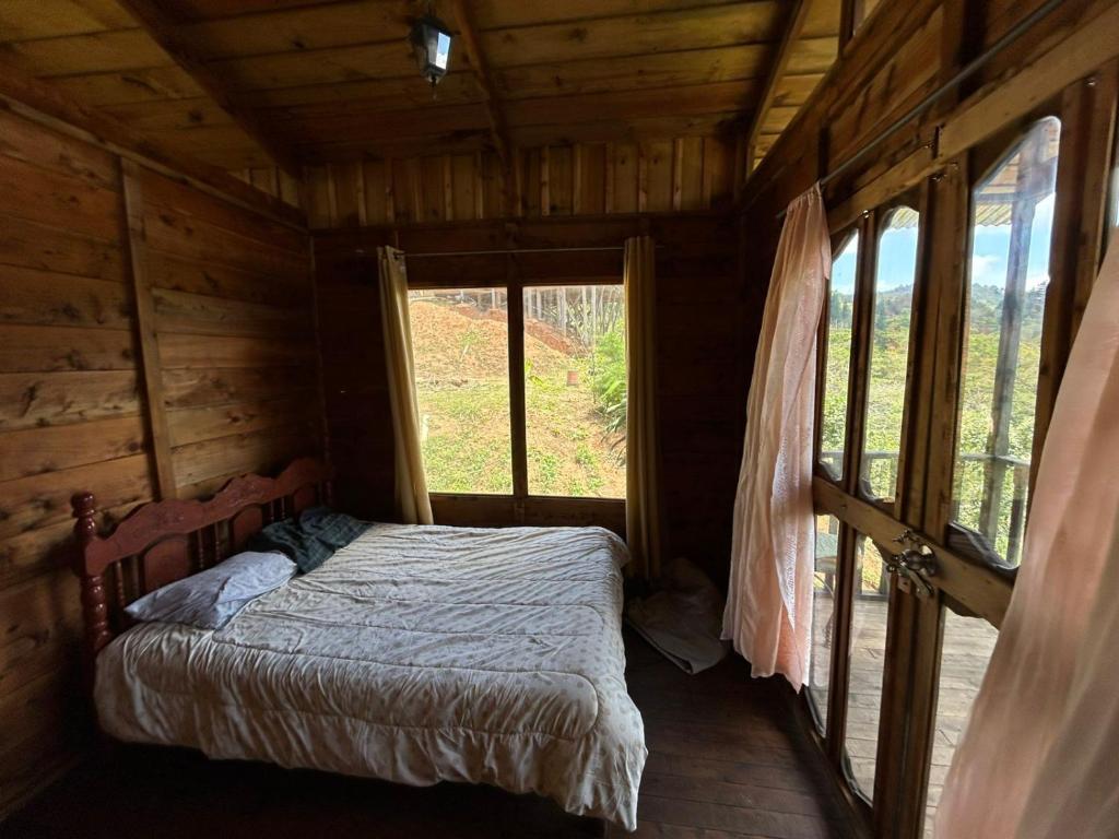 Postel nebo postele na pokoji v ubytování Cabañas la esperancita