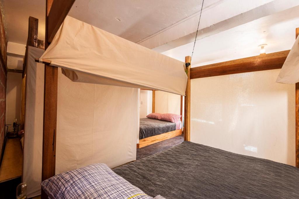 Letto o letti in una camera di Wolf Totem Steam Punk Guesthouse