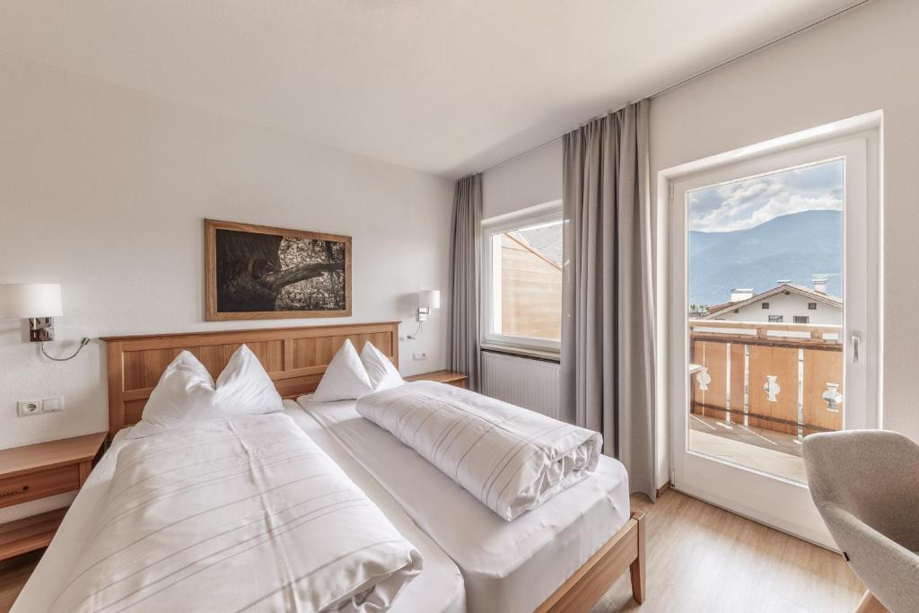 Postel nebo postele na pokoji v ubytování Hotel Oberwirt