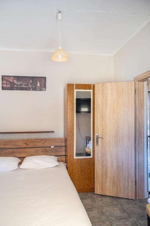 Кровать или кровати в номере Dimitri's Apartment