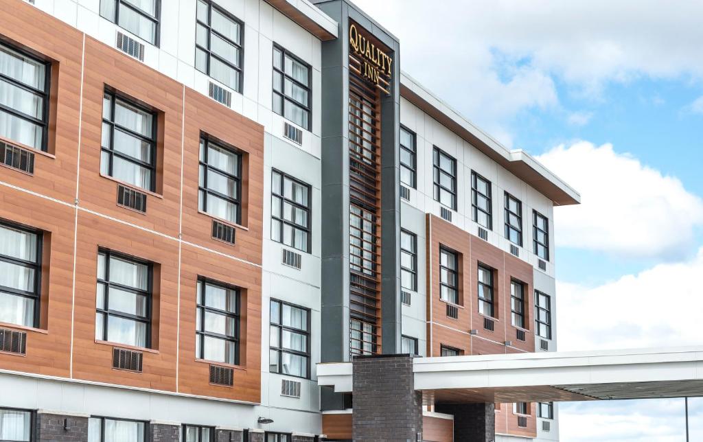 an artist rendering of the exterior of a building at Quality Inn Sept-Iles in Sept-Îles
