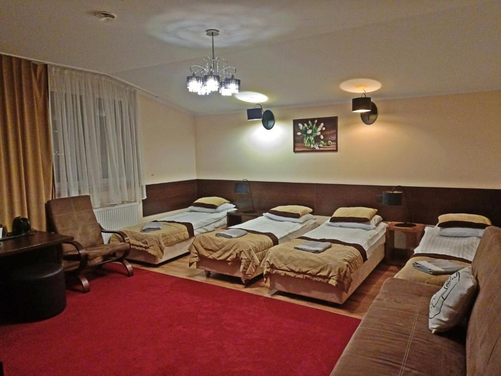 Postel nebo postele na pokoji v ubytování Hotel Ajax