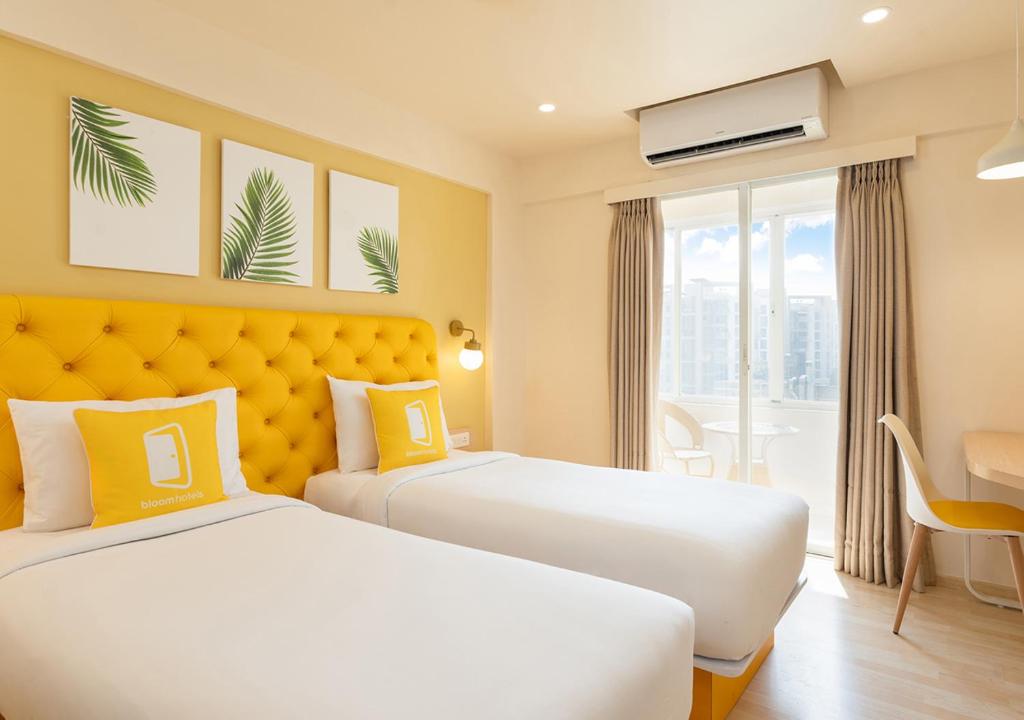Postel nebo postele na pokoji v ubytování Bloom Hotel Balewadi