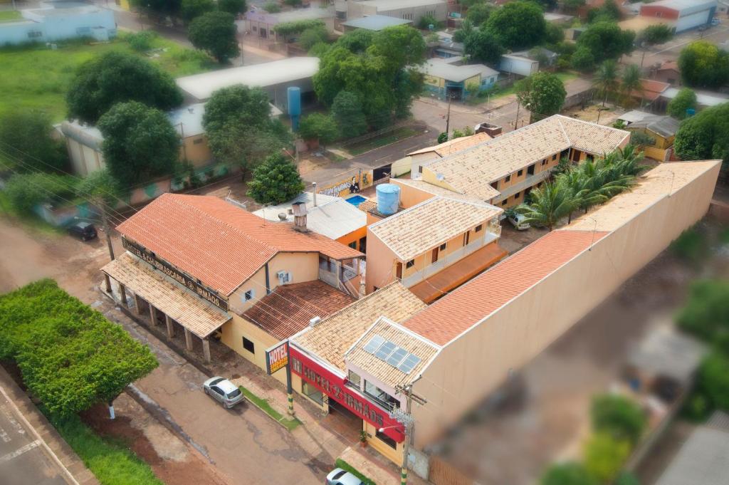 an overhead view of a house with a red fire truck at Hotel 2 Irmãos in Campo Grande