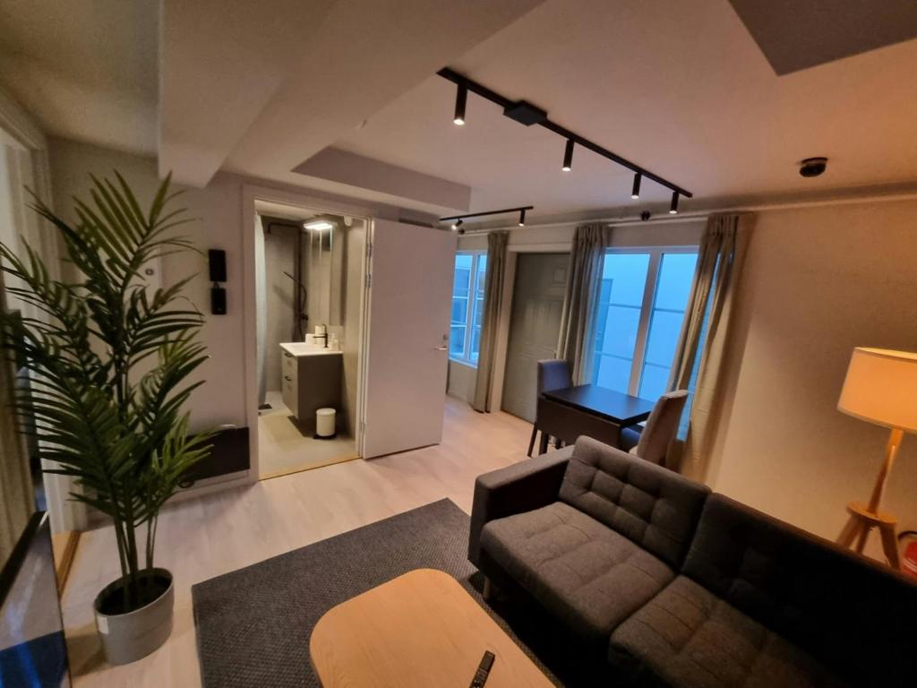 En eller flere senge i et værelse på Central Apartment for 4