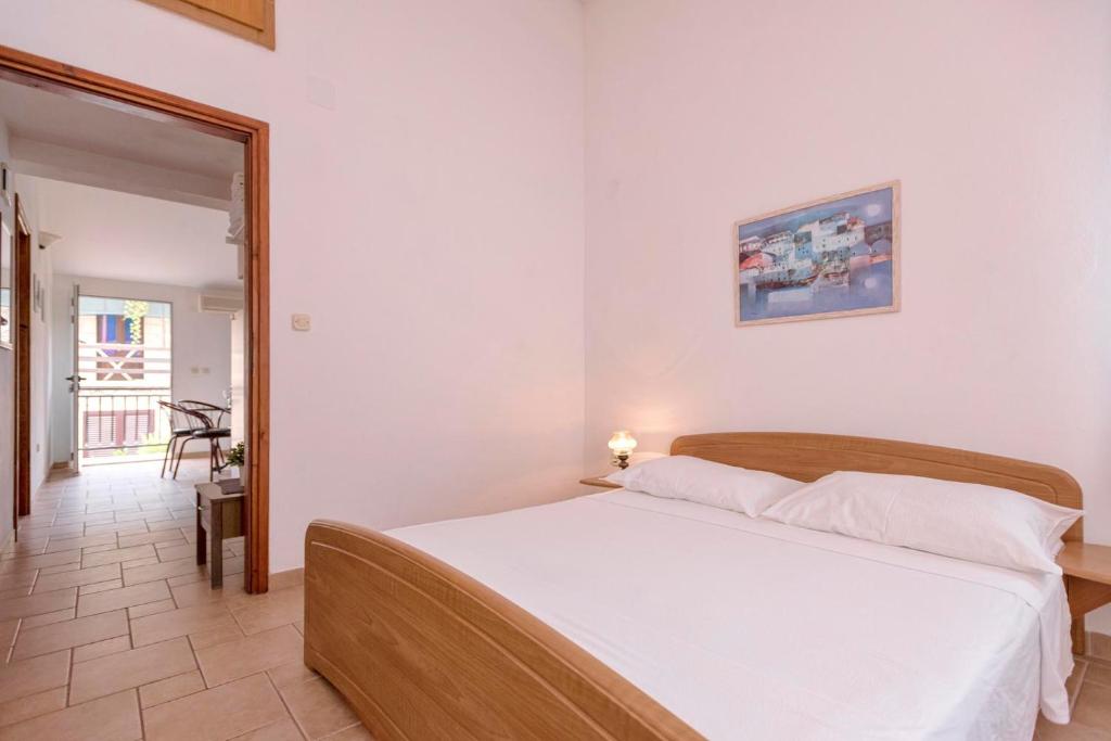 Postel nebo postele na pokoji v ubytování Apartments Zora