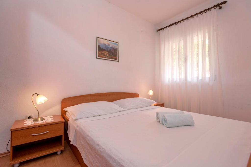 Postel nebo postele na pokoji v ubytování Apartments Zora