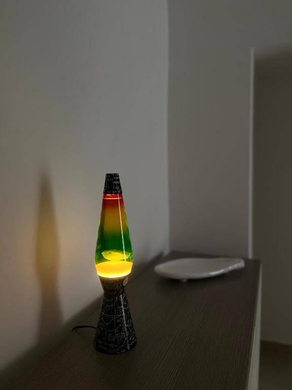 a glass lamp sitting on top of a table at De Medici Home in Terlizzi